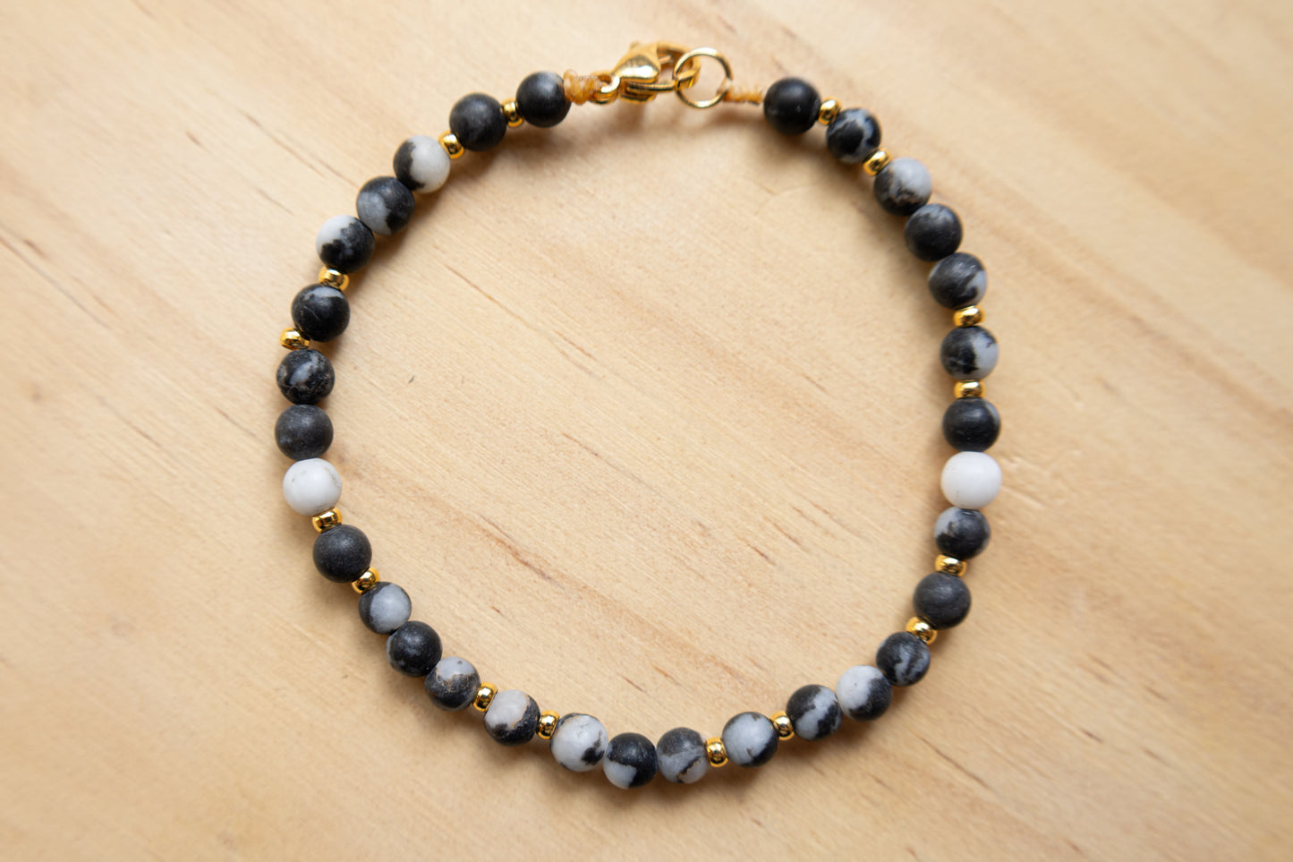 Jasper black and white bracelet gold plated