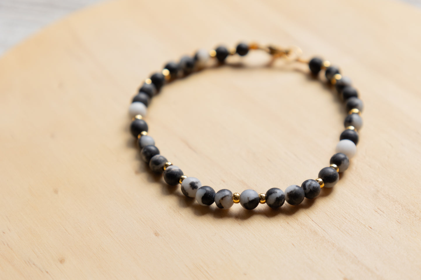 Jasper black and white bracelet gold plated